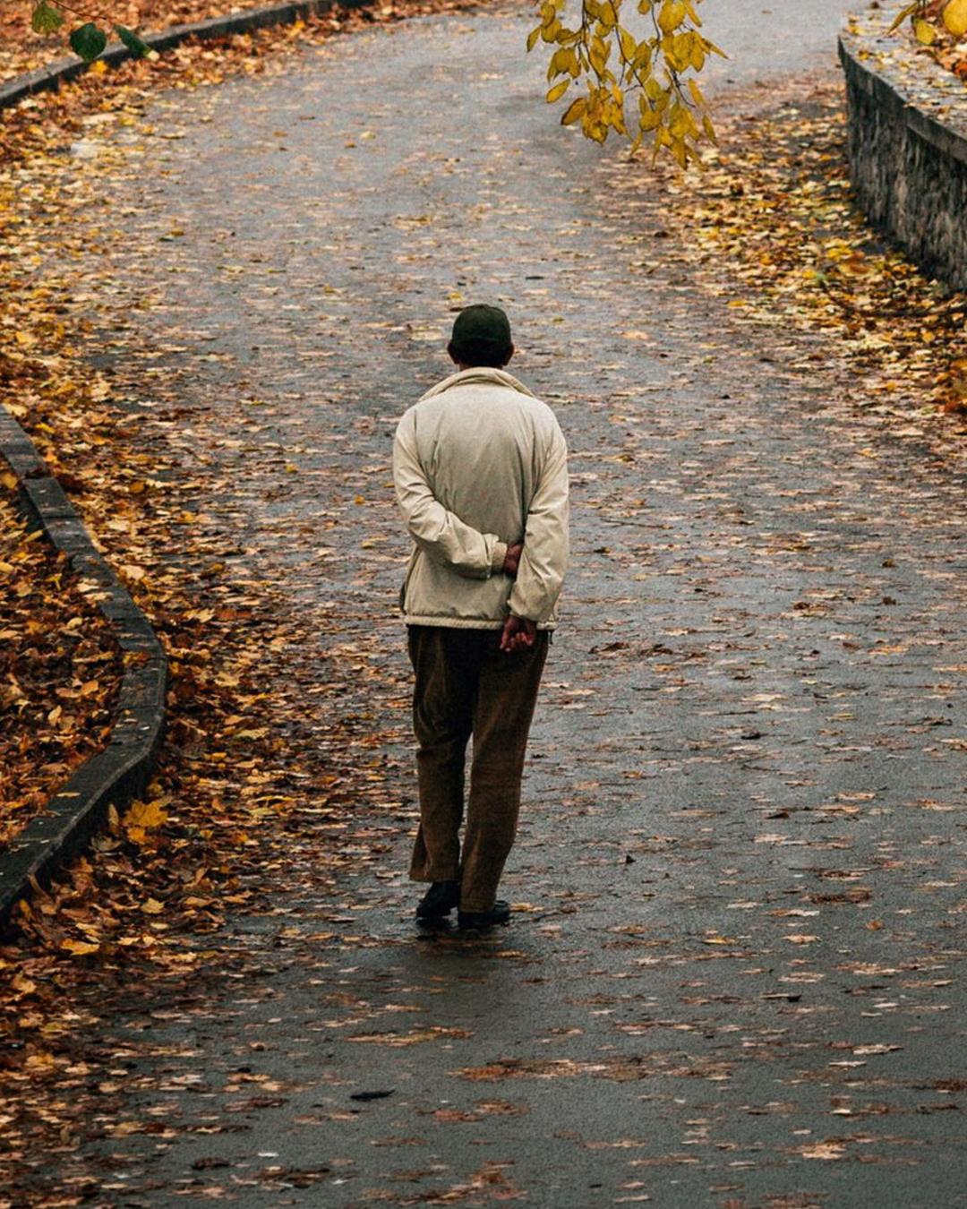 Man walking in leaves